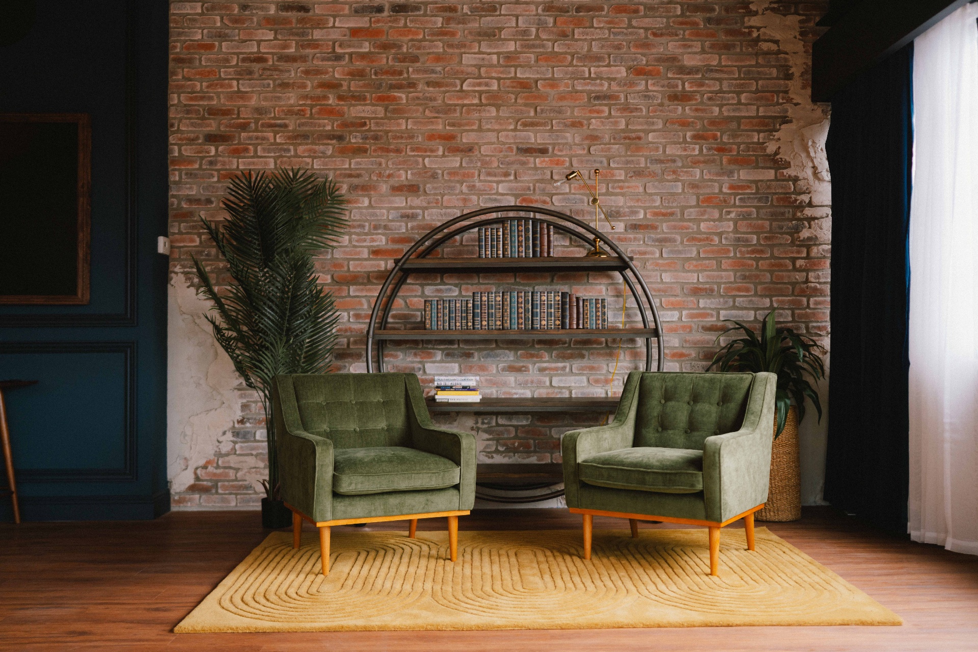 Green chairs with bookshelf detail