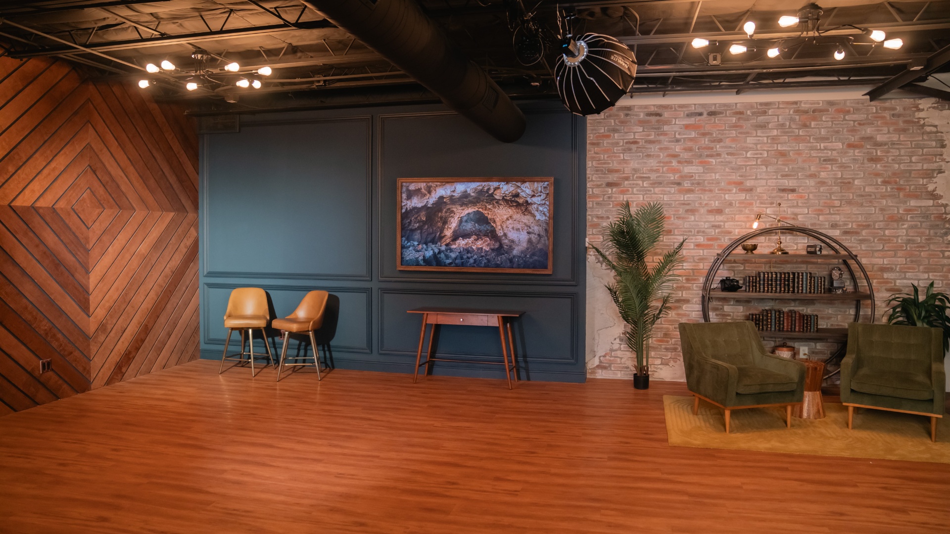Lounge with wood paneling and brick