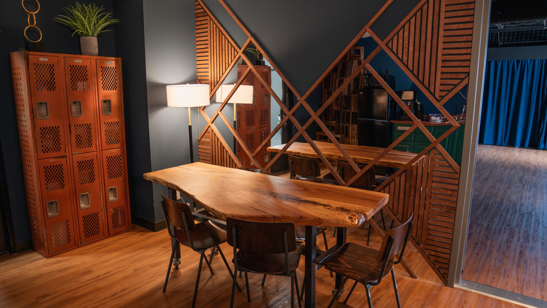 Green room with live-edge table and lockers