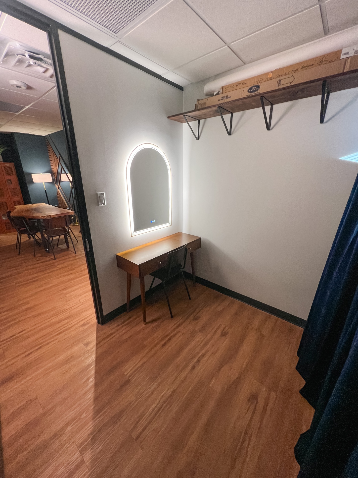 Hair and makeup room with lit mirror